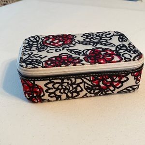 Coach jewelry case. The flowers are red and bright pink.